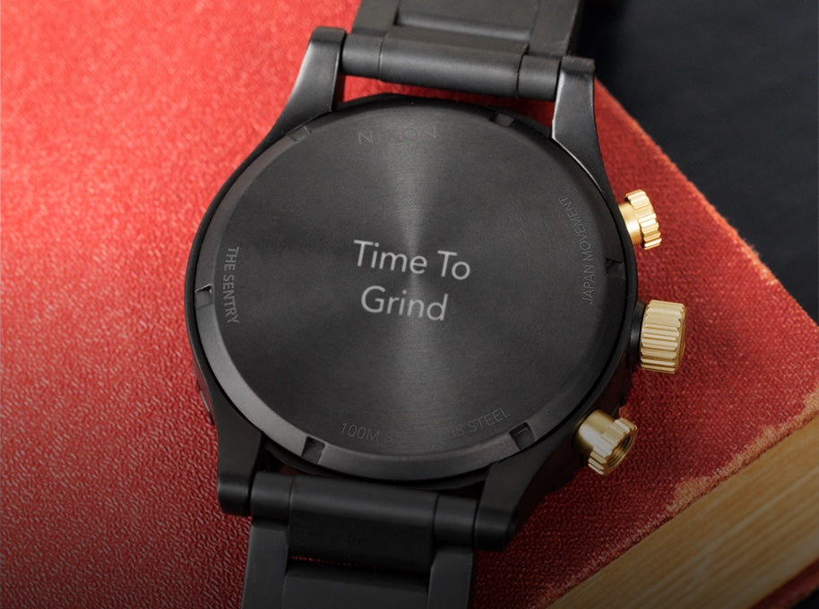 Nixon Sentry engraved with "Time to grind" for a graduation gift.