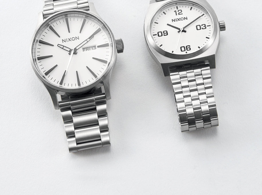 Two Nixon wedding gift watches in silver and white