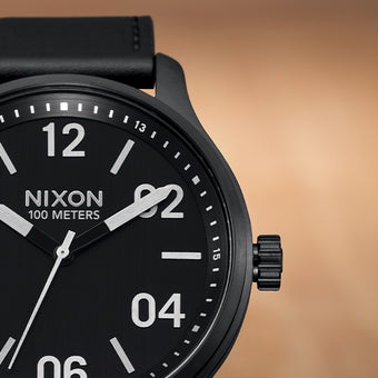 A closeup of a Nixon analog watch.